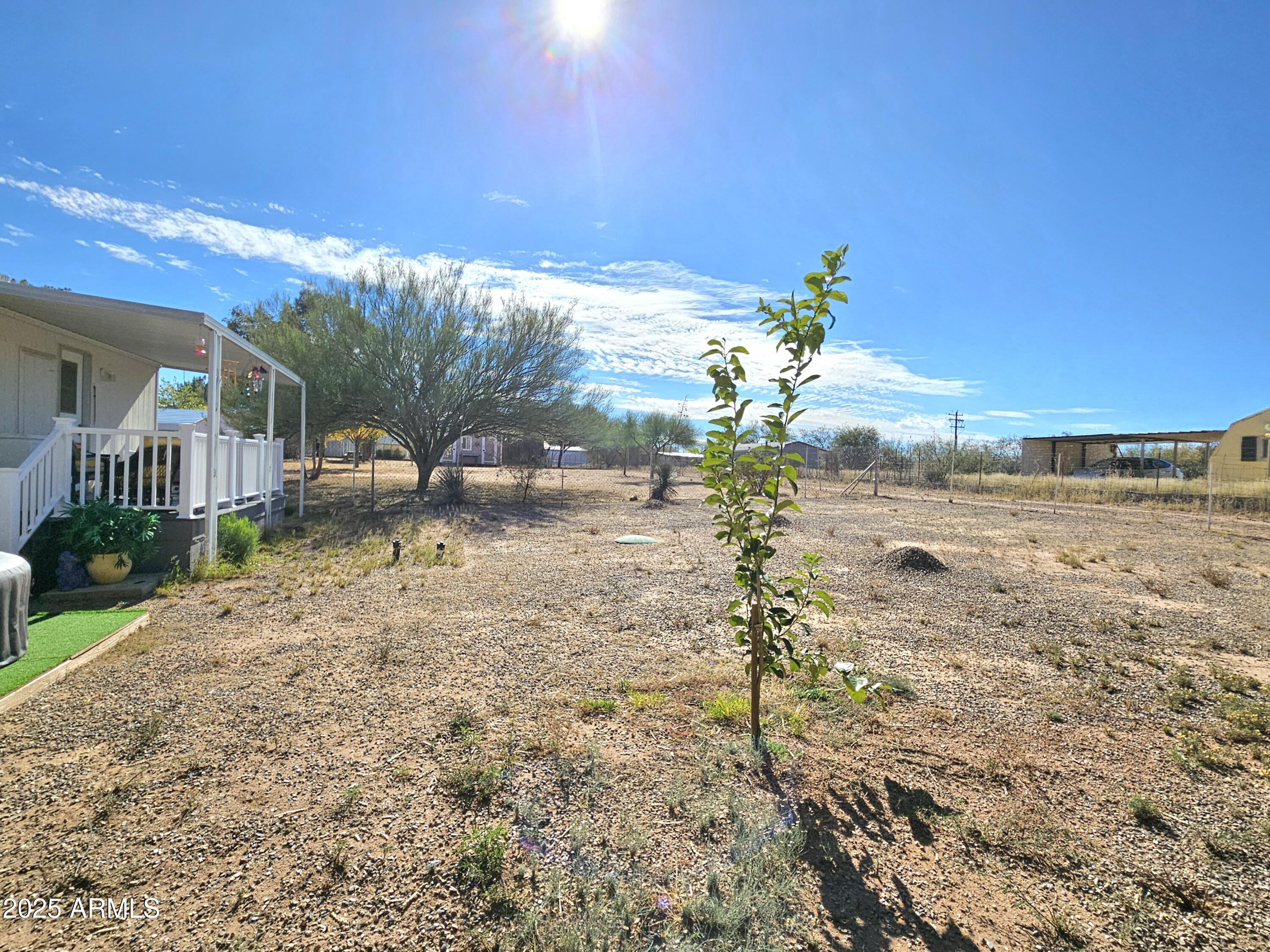 284 North Warren Road Benson, AZ 85602 - Photo 6 of 33 a view of a yard with an outdoor space