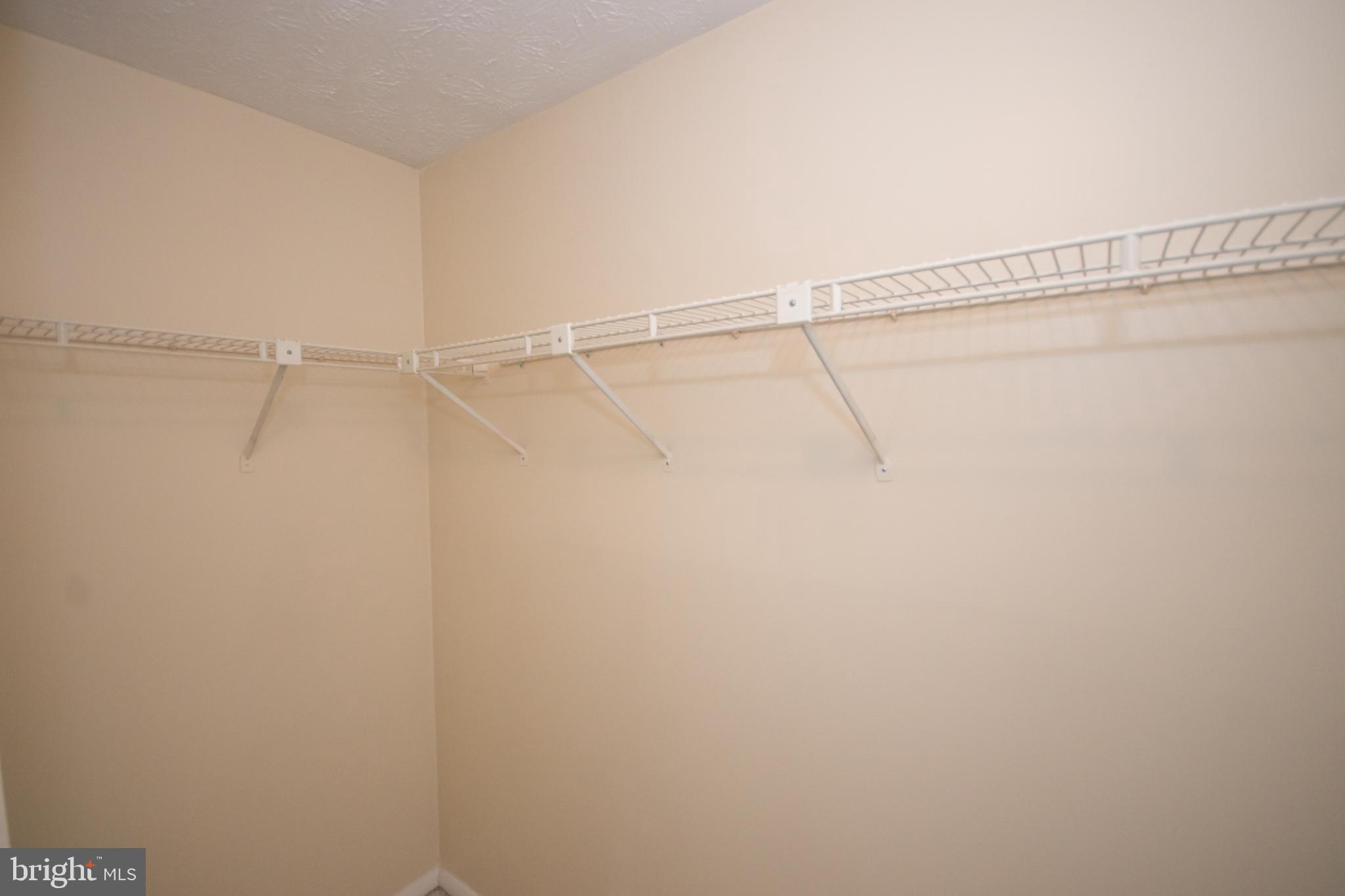 7993 Tyson Oaks Circle Vienna, VA 22182 - Photo 12 of 25 a view of a room with racks on the wall