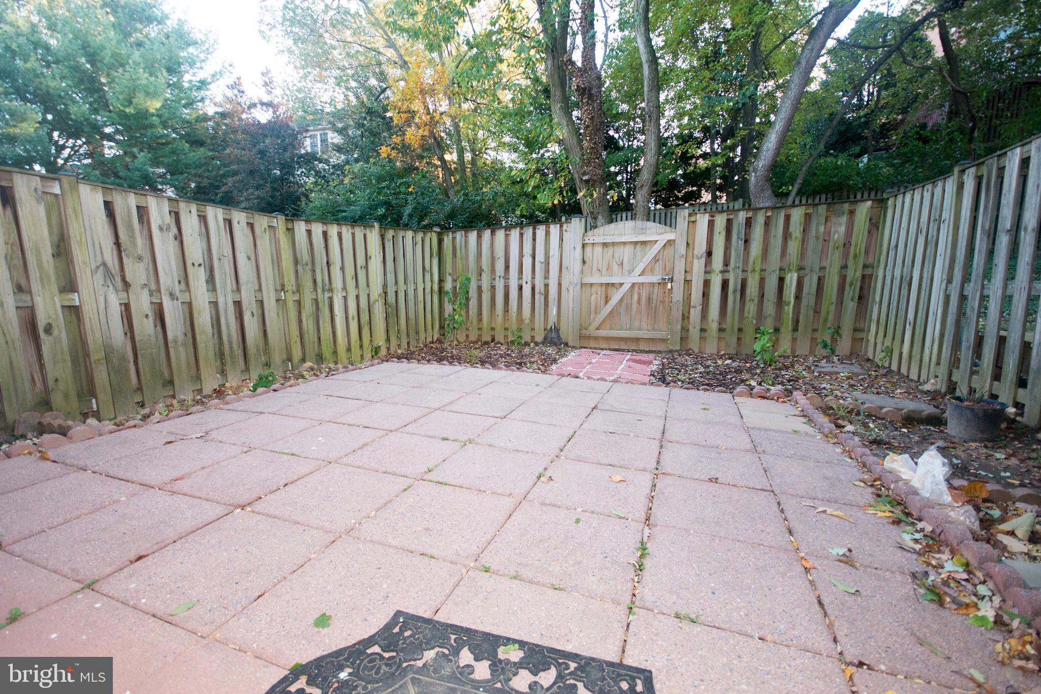 7993 Tyson Oaks Circle Vienna, VA 22182 - Photo 20 of 25 a view of backyard with wooden fence