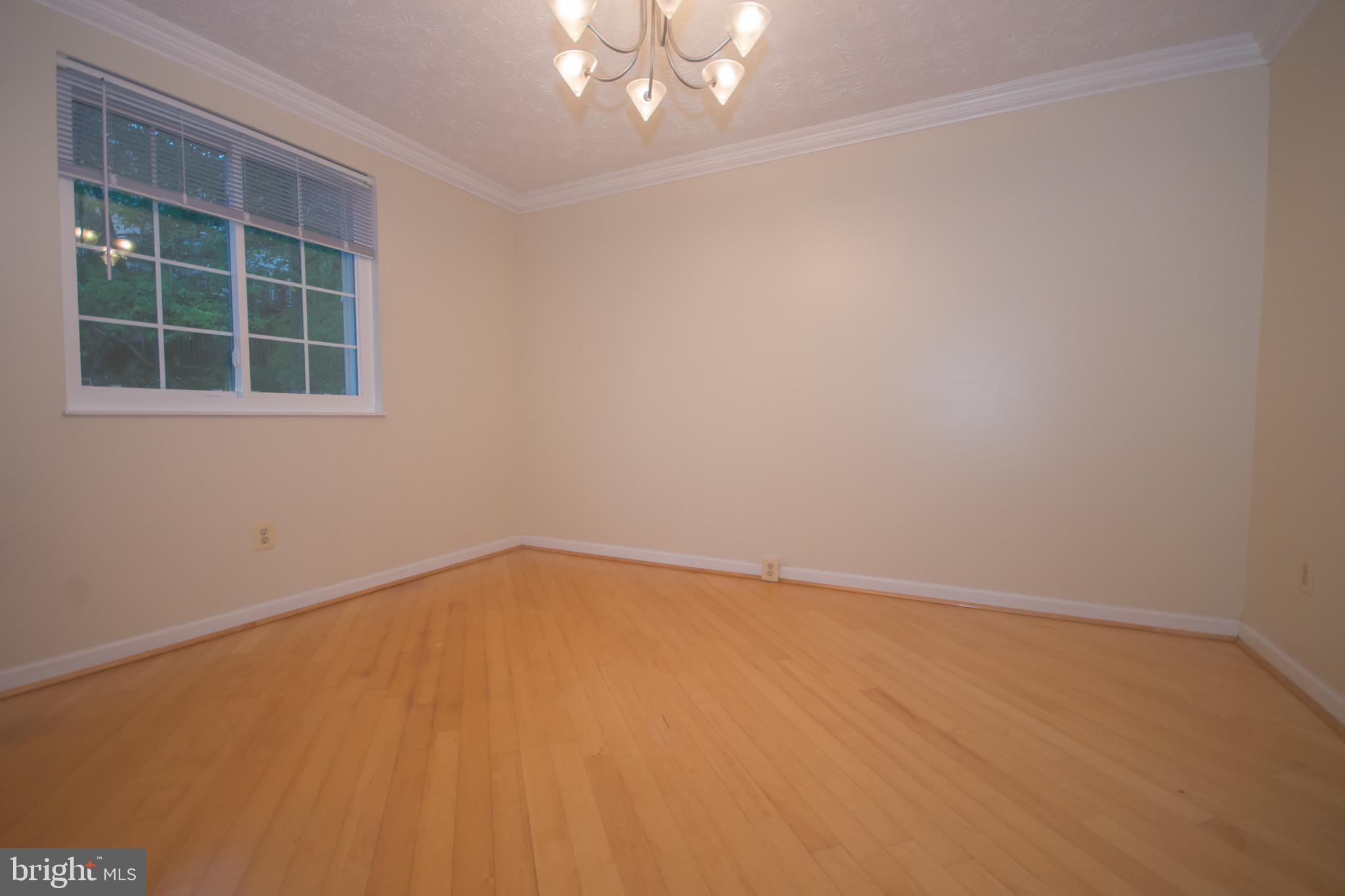 7993 Tyson Oaks Circle Vienna, VA 22182 - Photo 8 of 25 an empty room with a window