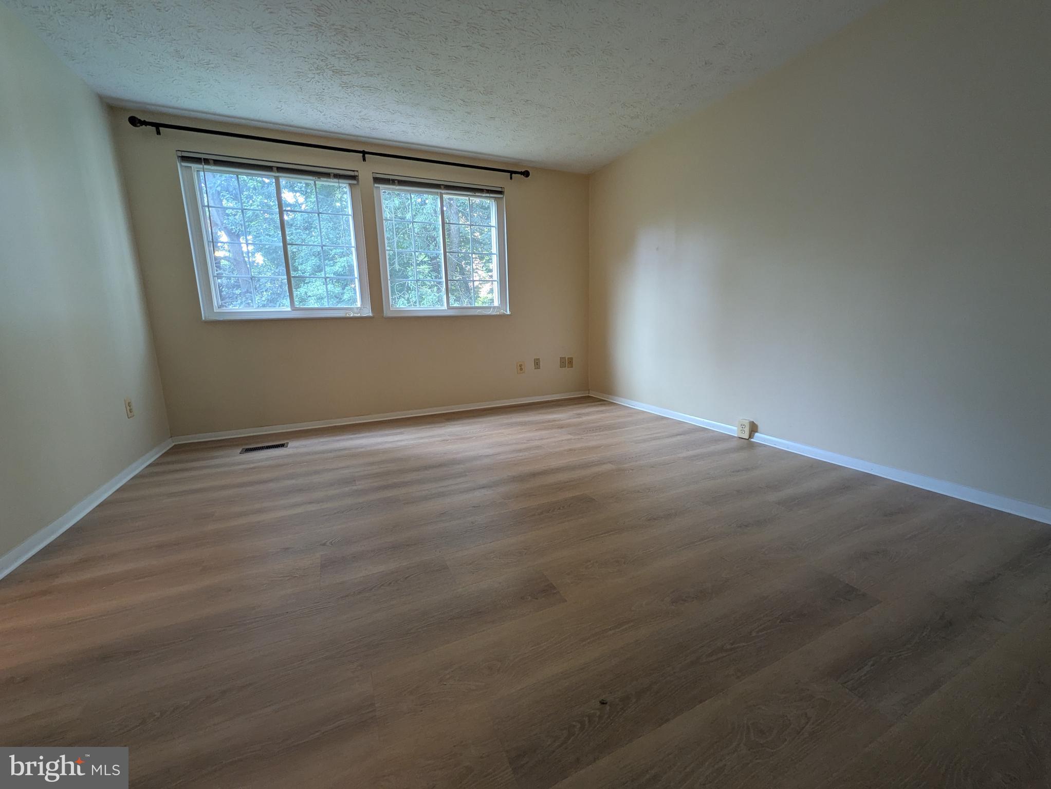 7993 Tyson Oaks Circle Vienna, VA 22182 - Photo 10 of 25 an empty room with a window