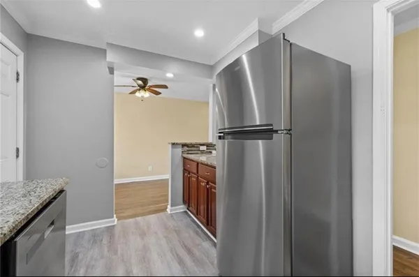 a view of a kitchen from a hallway