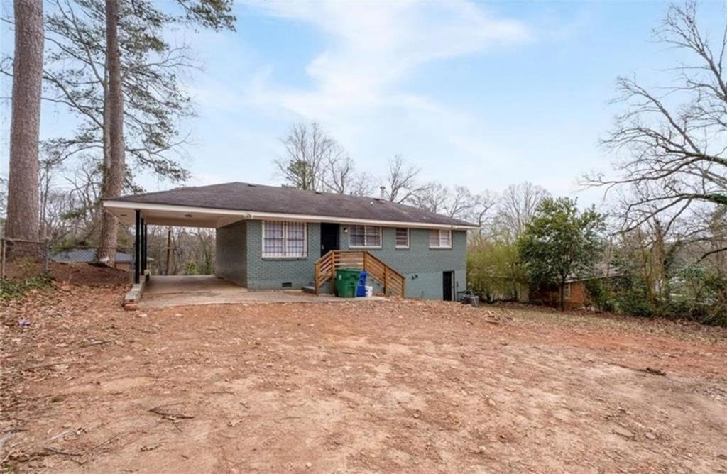 2911 Gresham Rd S East Atlanta, GA 30316 - Photo 22 of 22 a view of a house with a yard and roof
