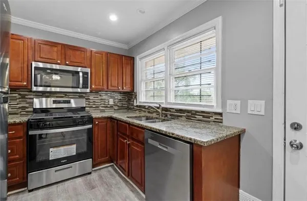 a kitchen with a stove and a microwave
