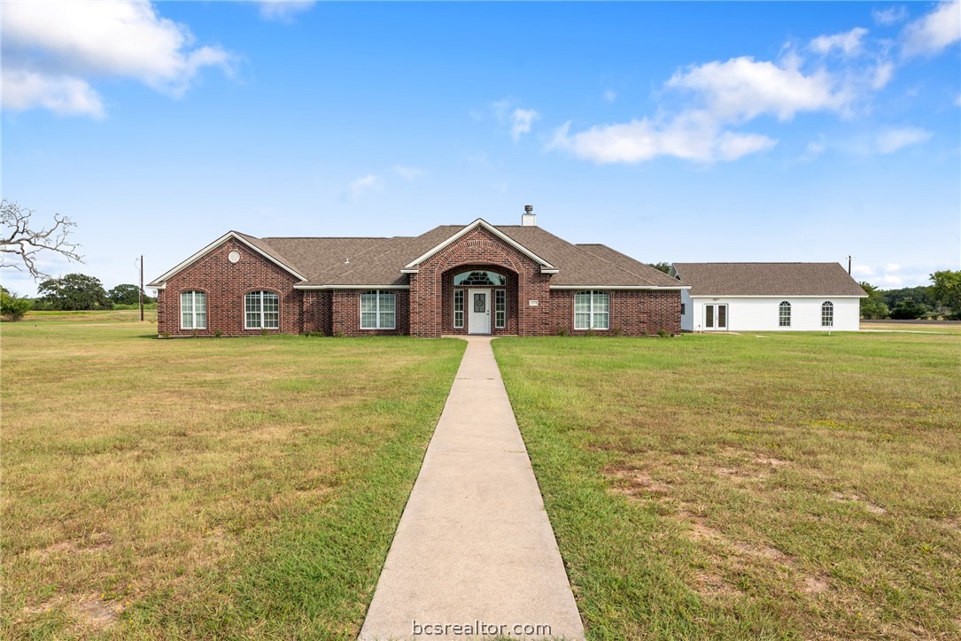 6100 Whitetail Lane Bryan, TX 77808 - Photo 1 of 37 a view of a house with garden