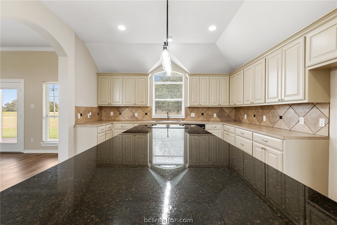 6100 Whitetail Lane Bryan, TX 77808 - Photo 12 of 37 a kitchen with a white cabinets and window