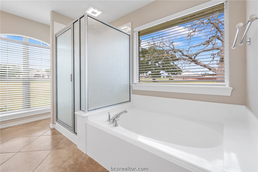 6100 Whitetail Lane Bryan, TX 77808 - Photo 19 of 37 a white bath tub sitting next to a window