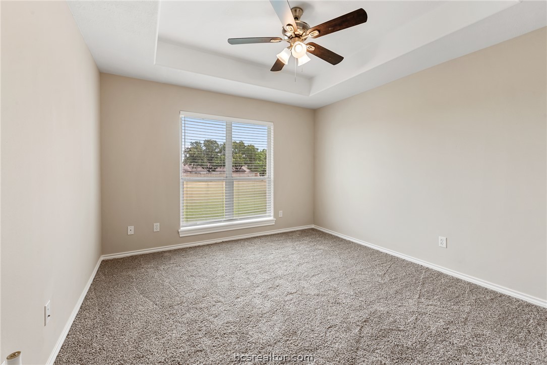 6100 Whitetail Lane Bryan, TX 77808 - Photo 25 of 37 an empty room with a window and a fan