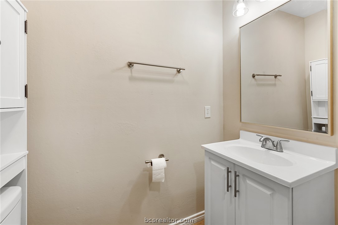 6100 Whitetail Lane Bryan, TX 77808 - Photo 26 of 37 a bathroom with a sink and a mirror