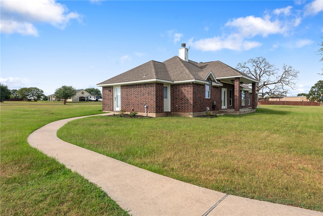 6100 Whitetail Lane Bryan, TX 77808 - Photo 31 of 37 a front view of a house with a yard