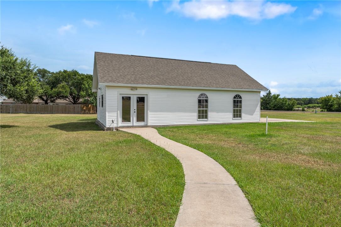 6100 Whitetail Lane Bryan, TX 77808 - Photo 32 of 37 a front view of a house with garden