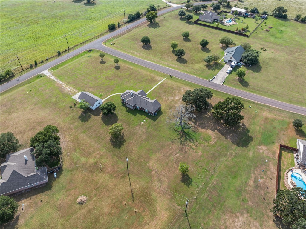 6100 Whitetail Lane Bryan, TX 77808 - Photo 37 of 37 an aerial view of a house with a swimming pool