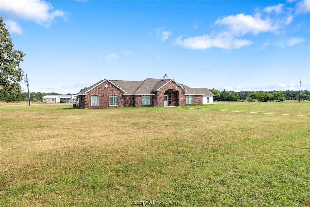 6100 Whitetail Lane Bryan, TX 77808 - Photo 4 of 37 a view of a house with yard and ocean view