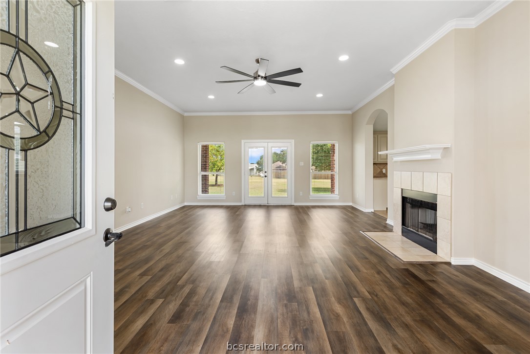 6100 Whitetail Lane Bryan, TX 77808 - Photo 6 of 37 a view of an empty room with wooden floor and a window