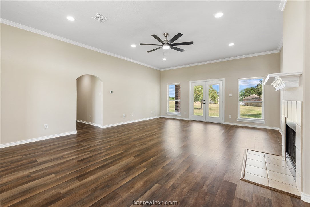 6100 Whitetail Lane Bryan, TX 77808 - Photo 7 of 37 a view of an empty room with window and wooden floor