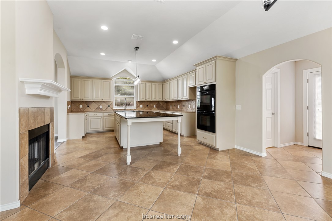 6100 Whitetail Lane Bryan, TX 77808 - Photo 10 of 37 a open kitchen with cabinets and stainless steel appliances