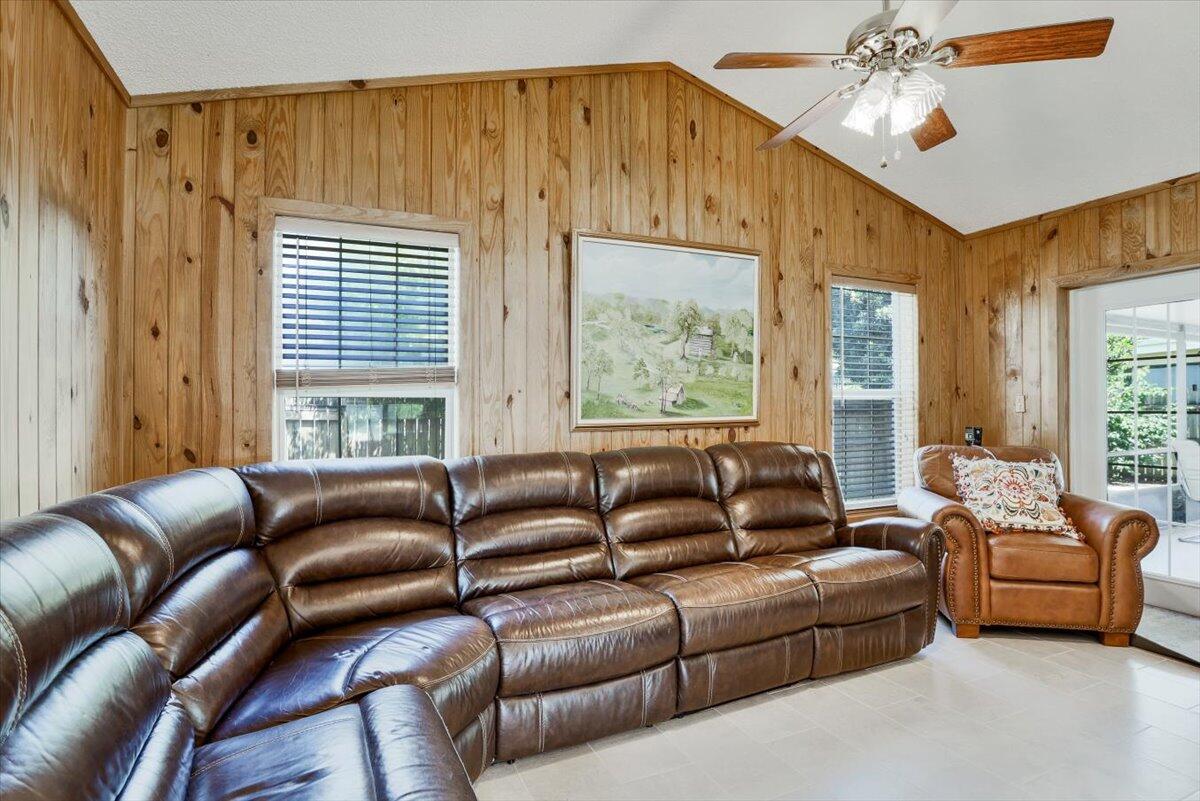 19681 Southeast County Line Road Tequesta, FL 33469 - Photo 14 of 45 a living room with furniture and a large window