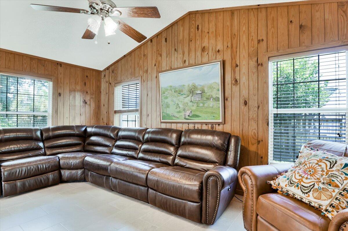 19681 Southeast County Line Road Tequesta, FL 33469 - Photo 15 of 45 a living room with furniture and a window