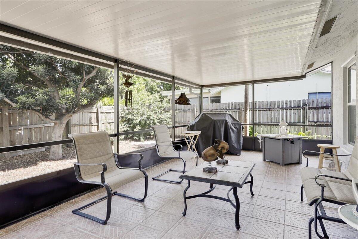19681 Southeast County Line Road Tequesta, FL 33469 - Photo 26 of 45 a living room with furniture and a large window