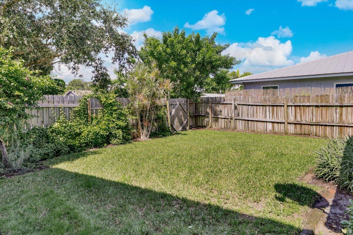 19681 Southeast County Line Road Tequesta, FL 33469 - Photo 29 of 45 a view of backyard and tree