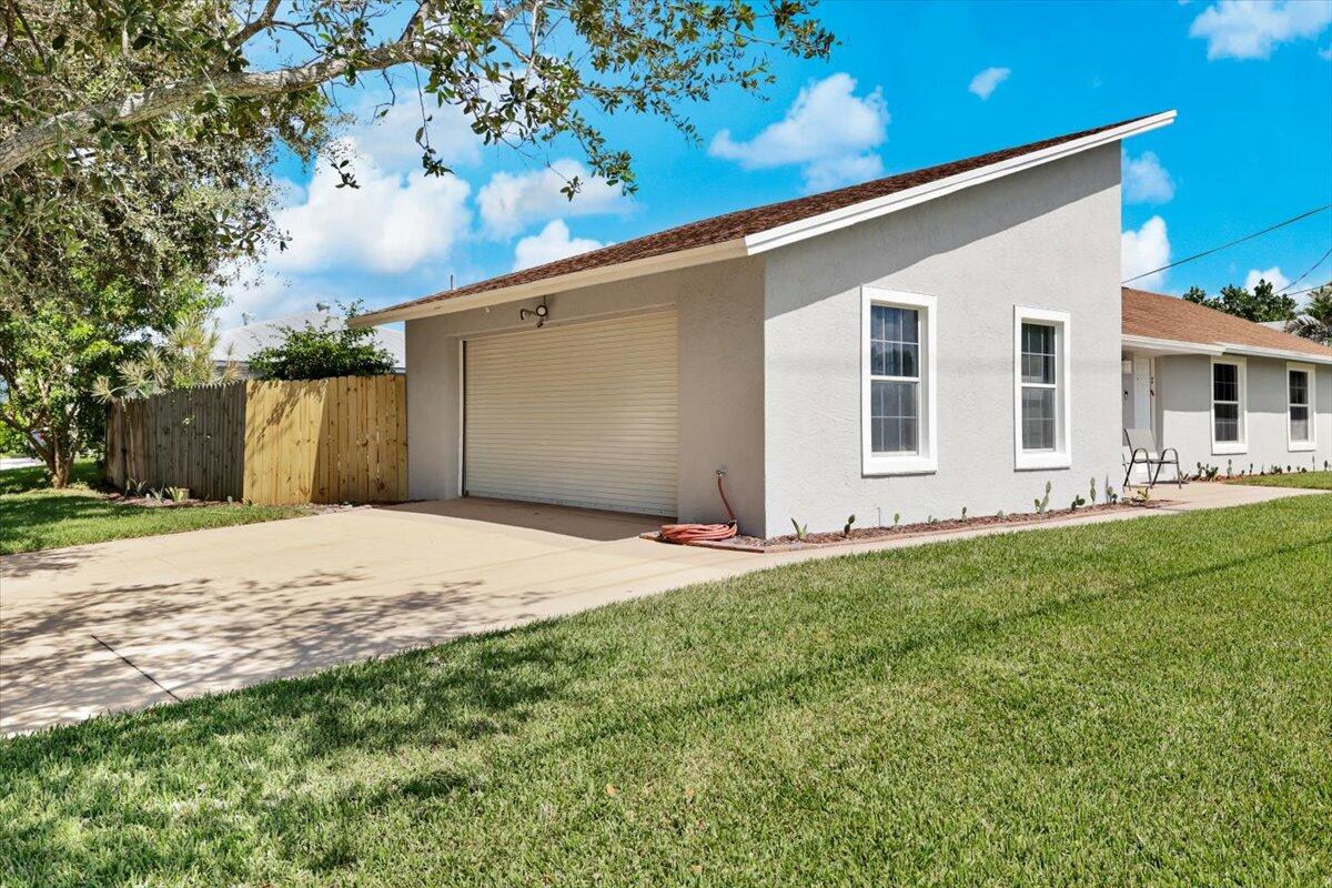 19681 Southeast County Line Road Tequesta, FL 33469 - Photo 4 of 45 a house view with a backyard space