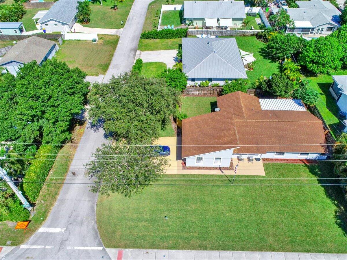 19681 Southeast County Line Road Tequesta, FL 33469 - Photo 35 of 45 an aerial view of residential houses with outdoor space and street view