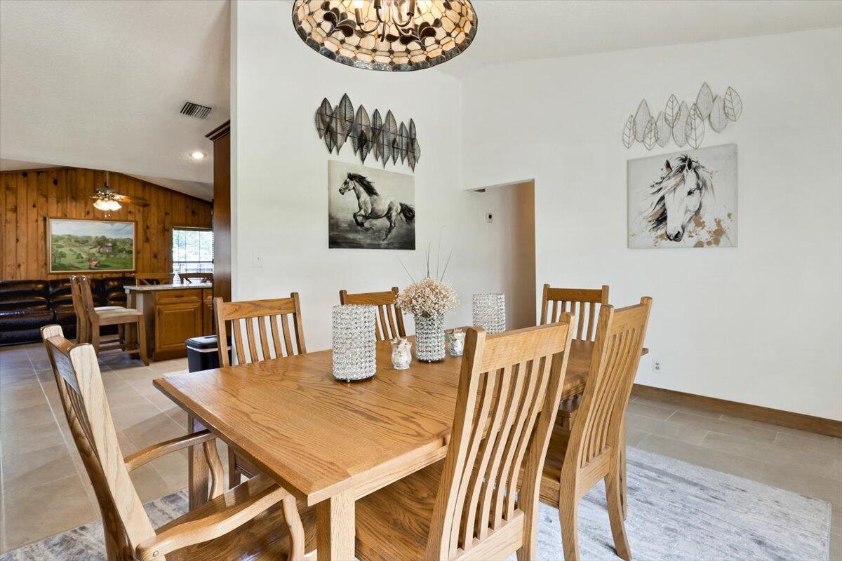 19681 Southeast County Line Road Tequesta, FL 33469 - Photo 9 of 45 a dining room with furniture and wooden floor