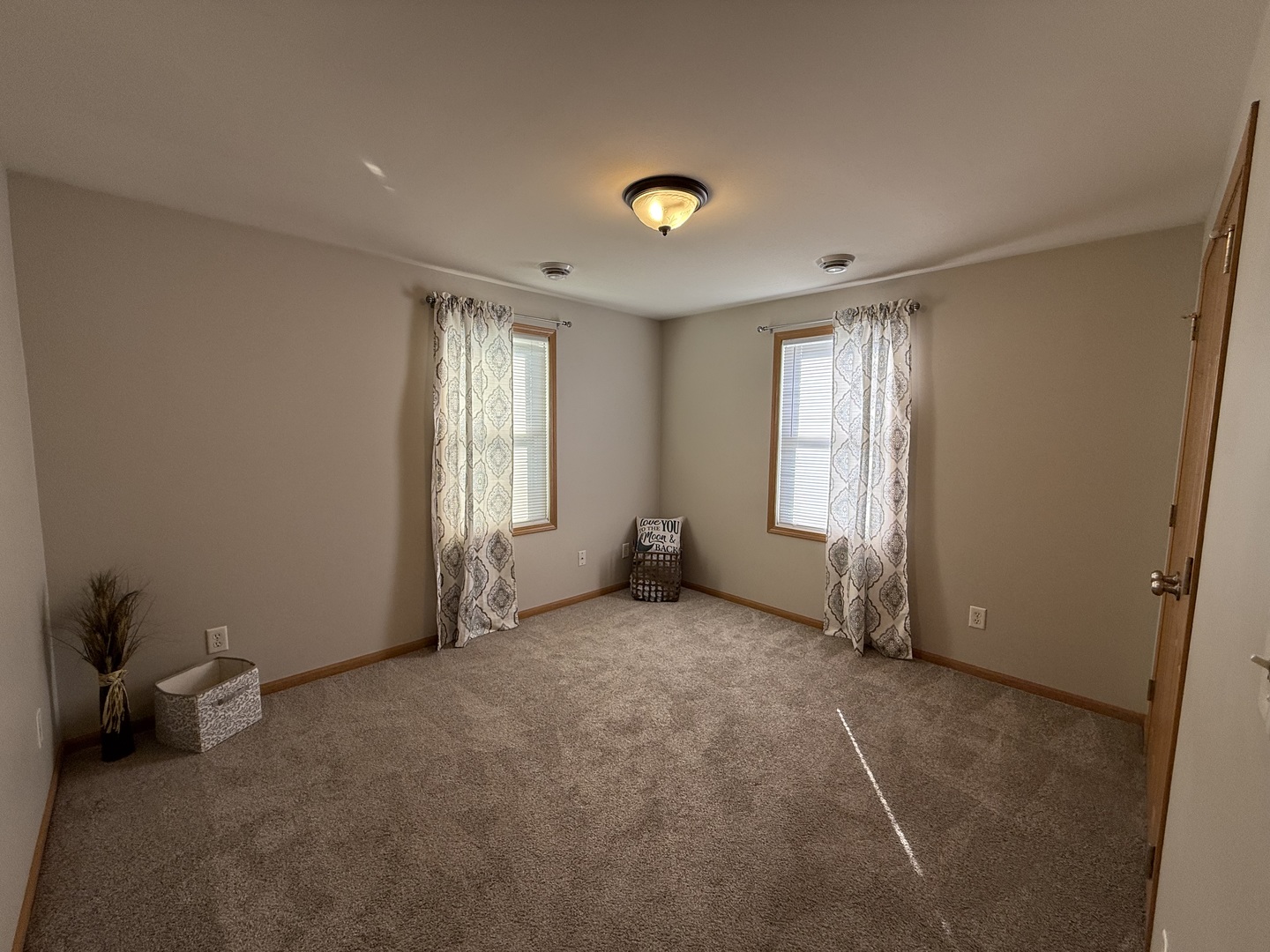 126 East Kerr Street Sycamore, IL 60178 - Photo 12 of 20 a view of an empty room with a window