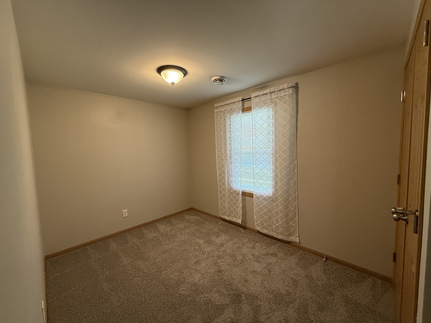126 East Kerr Street Sycamore, IL 60178 - Photo 17 of 20 an empty room with a empty space and windows