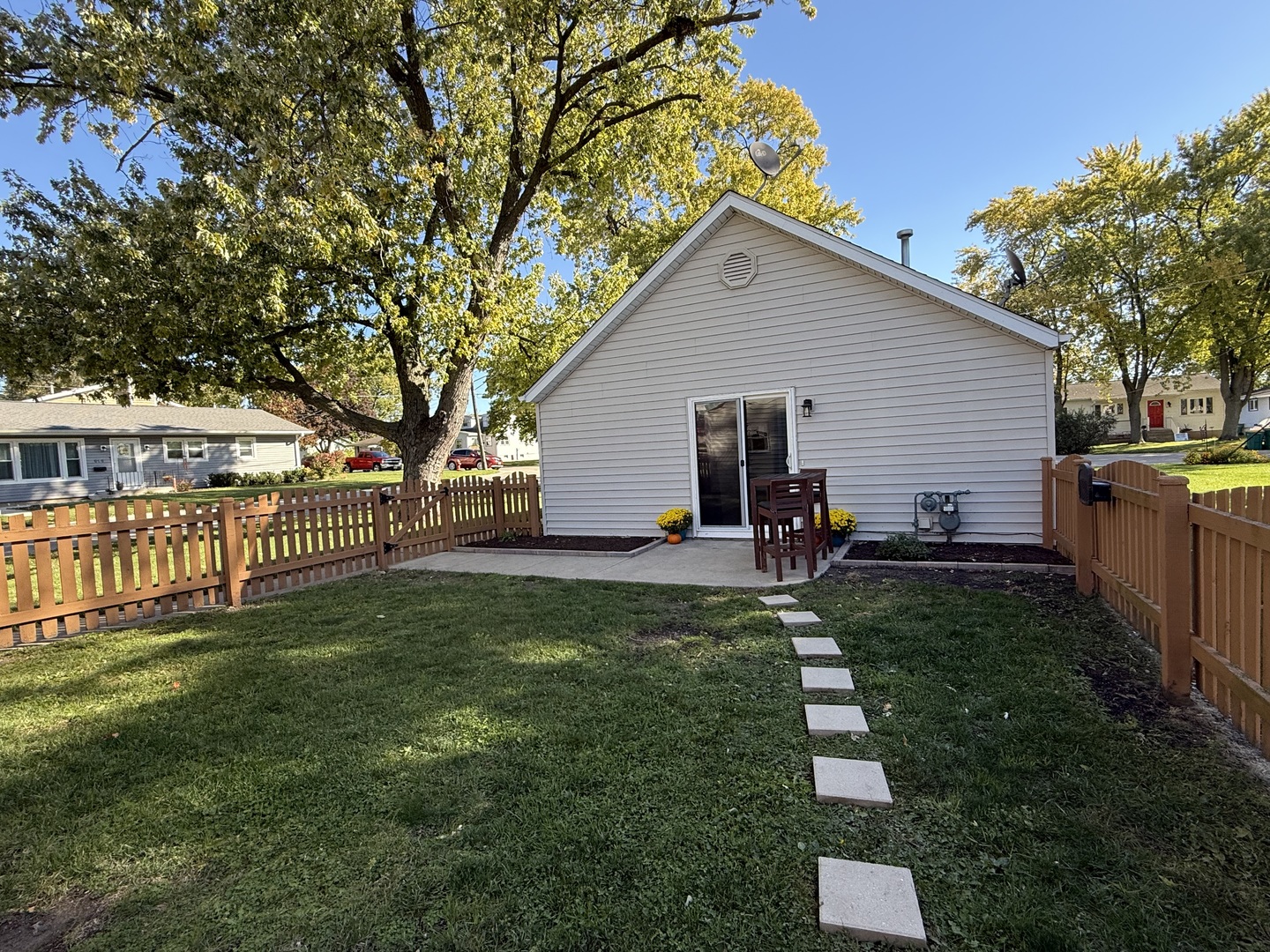 126 East Kerr Street Sycamore, IL 60178 - Photo 19 of 20 a view of a backyard with plants and patio
