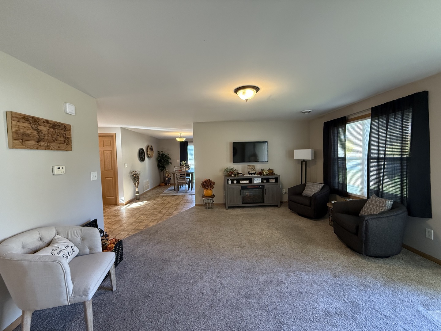 126 East Kerr Street Sycamore, IL 60178 - Photo 6 of 20 a living room with furniture and a flat screen tv