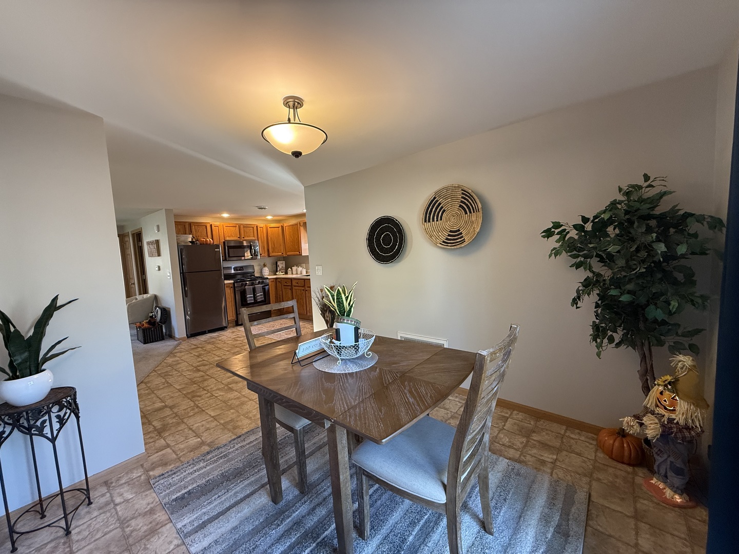 126 East Kerr Street Sycamore, IL 60178 - Photo 9 of 20 a view of a dining room with furniture and wooden floor