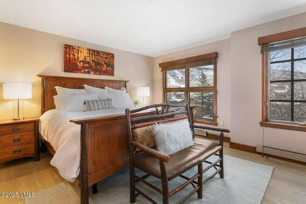 a bedroom with a bed and a table in it
