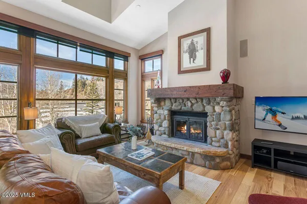 a living room with furniture and a fireplace