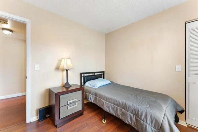 a bedroom with a bed and a table in it