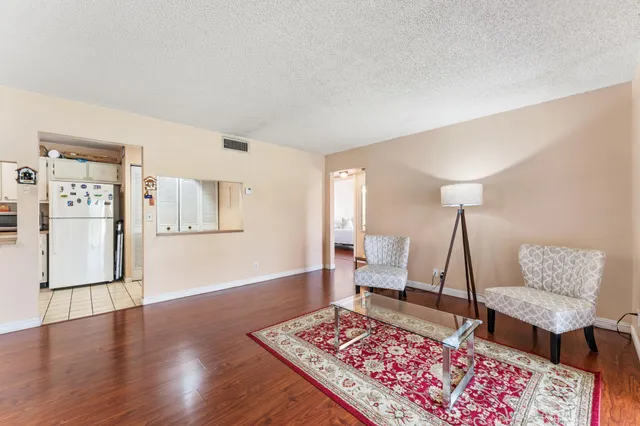 a living room with a rug