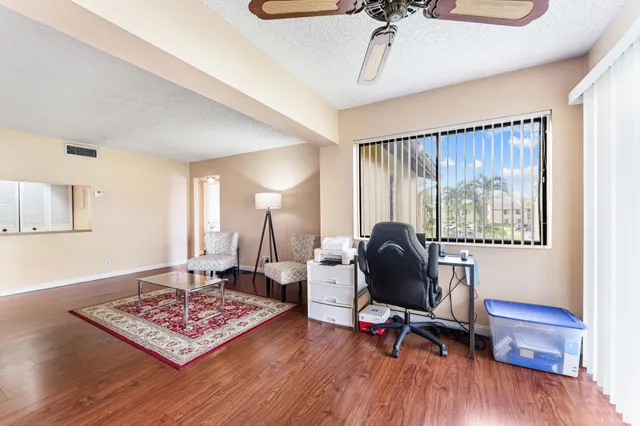 a living room with furniture rug and window