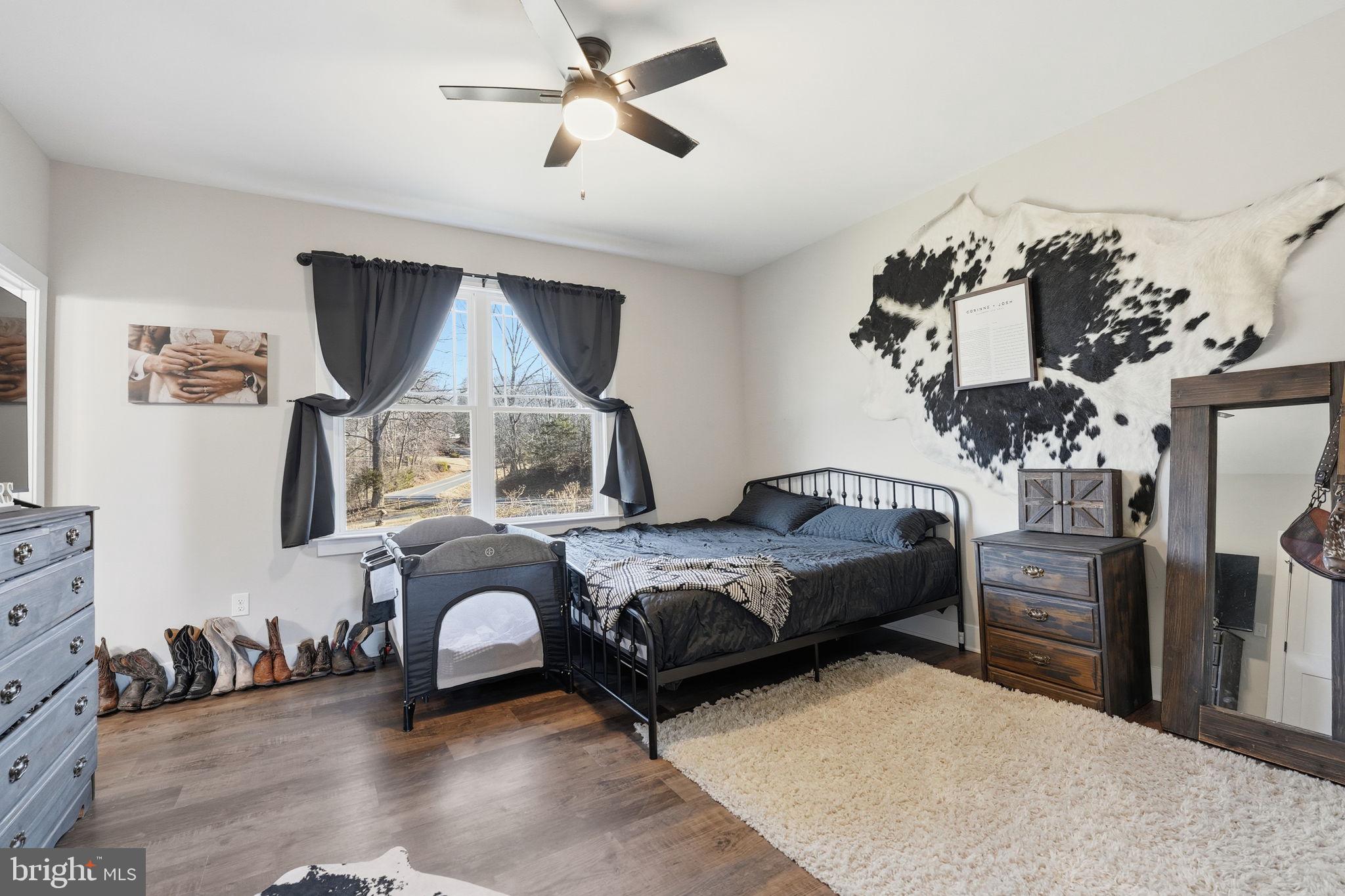 11183 Drogheda Mountain Road Culpeper, VA 22701 - Photo 16 of 60 a bedroom with furniture and a window