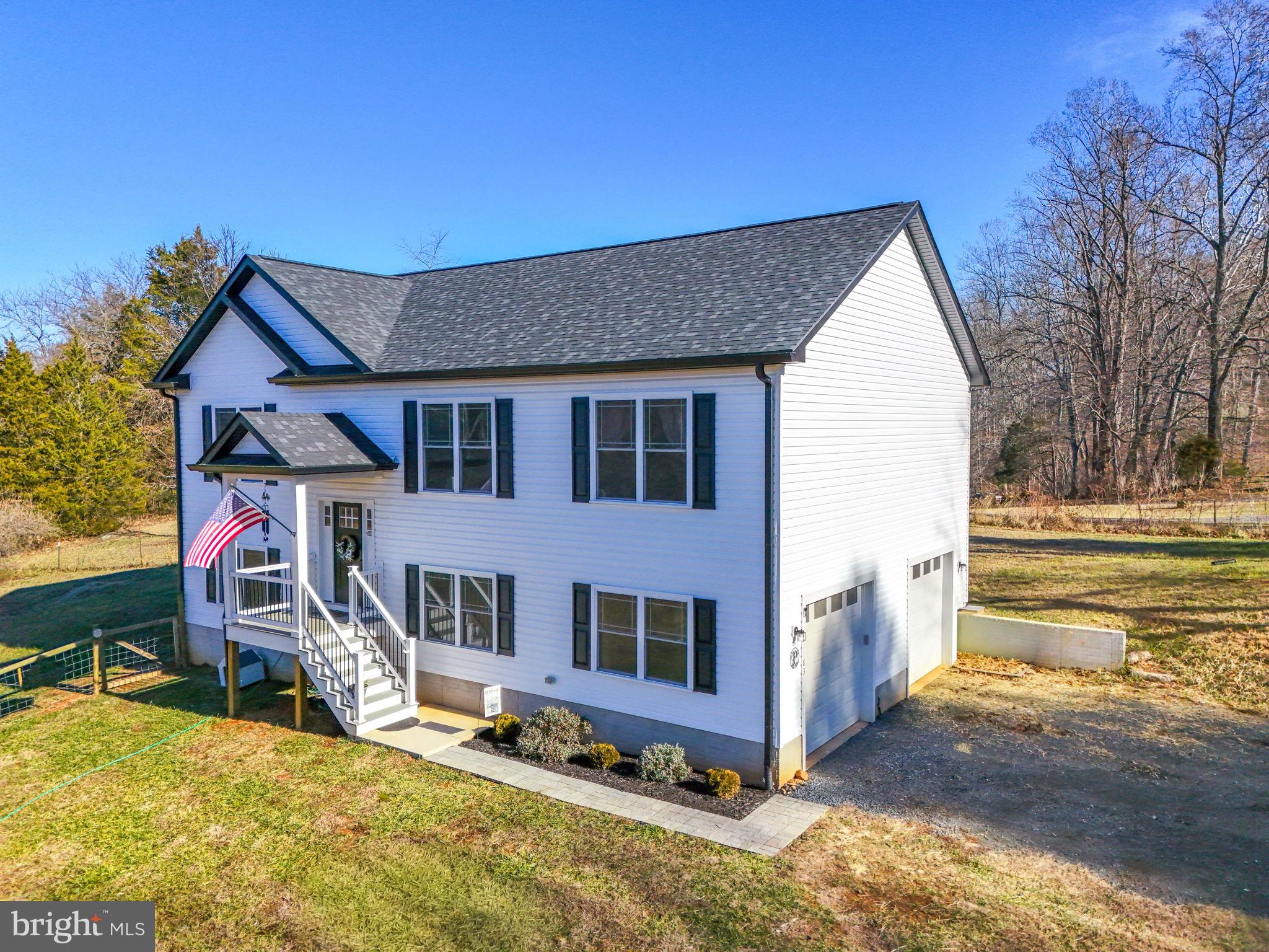 11183 Drogheda Mountain Road Culpeper, VA 22701 - Photo 3 of 60 a view of a house with a yard covered in snow