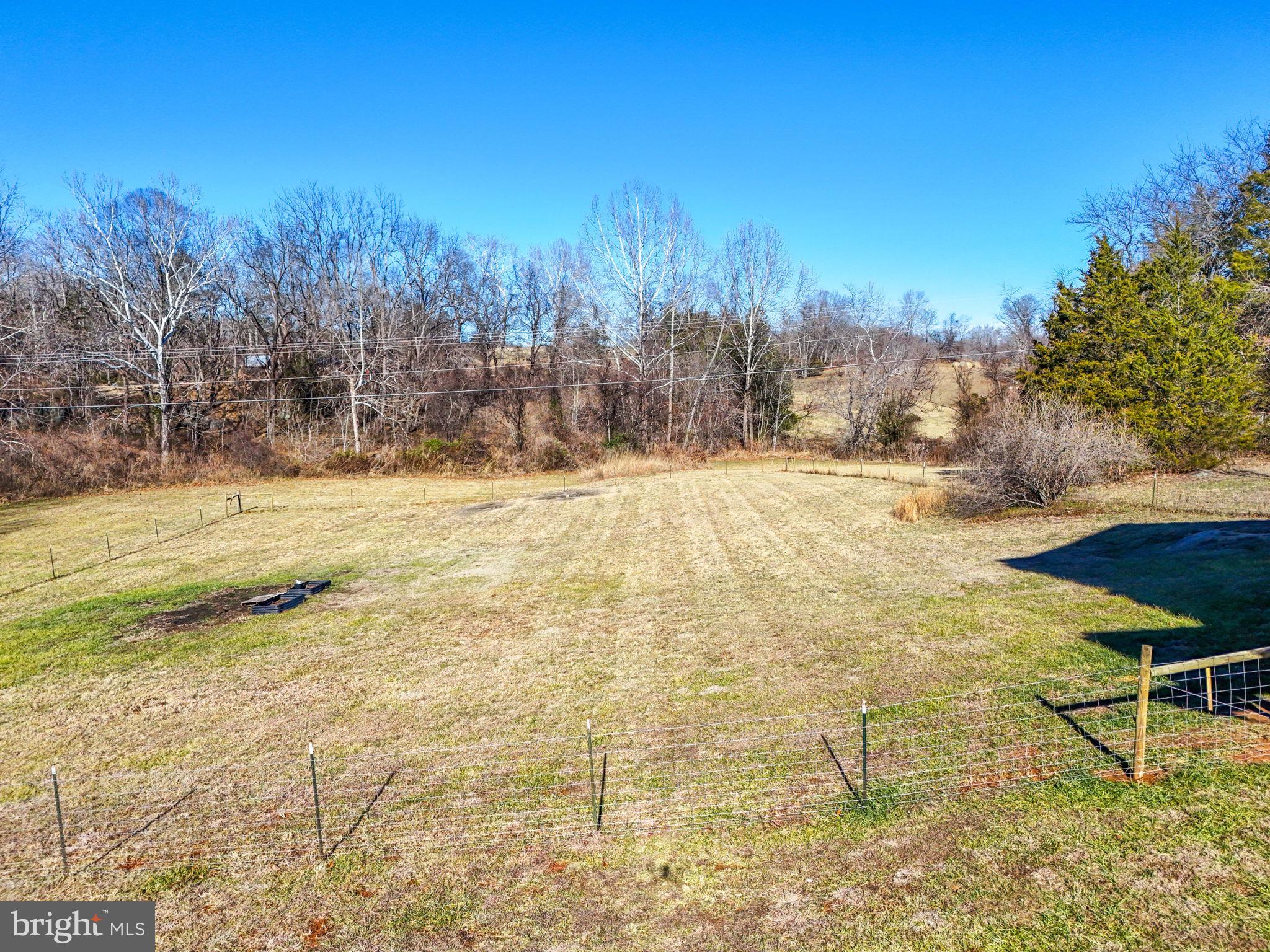 11183 Drogheda Mountain Road Culpeper, VA 22701 - Photo 35 of 60 a view of a yard with an outdoor space