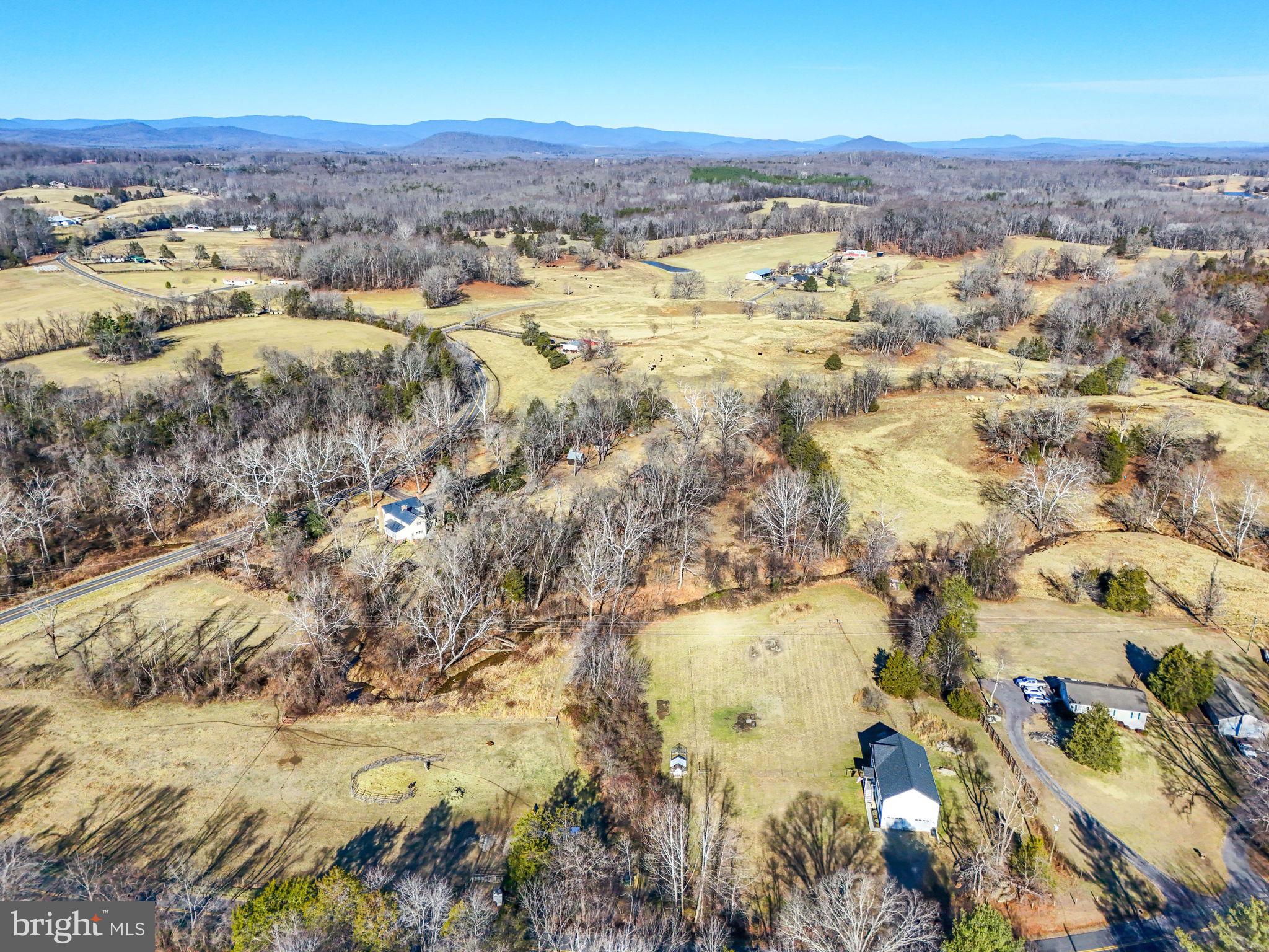 11183 Drogheda Mountain Road Culpeper, VA 22701 - Photo 49 of 60 an aerial view of residential houses with outdoor space