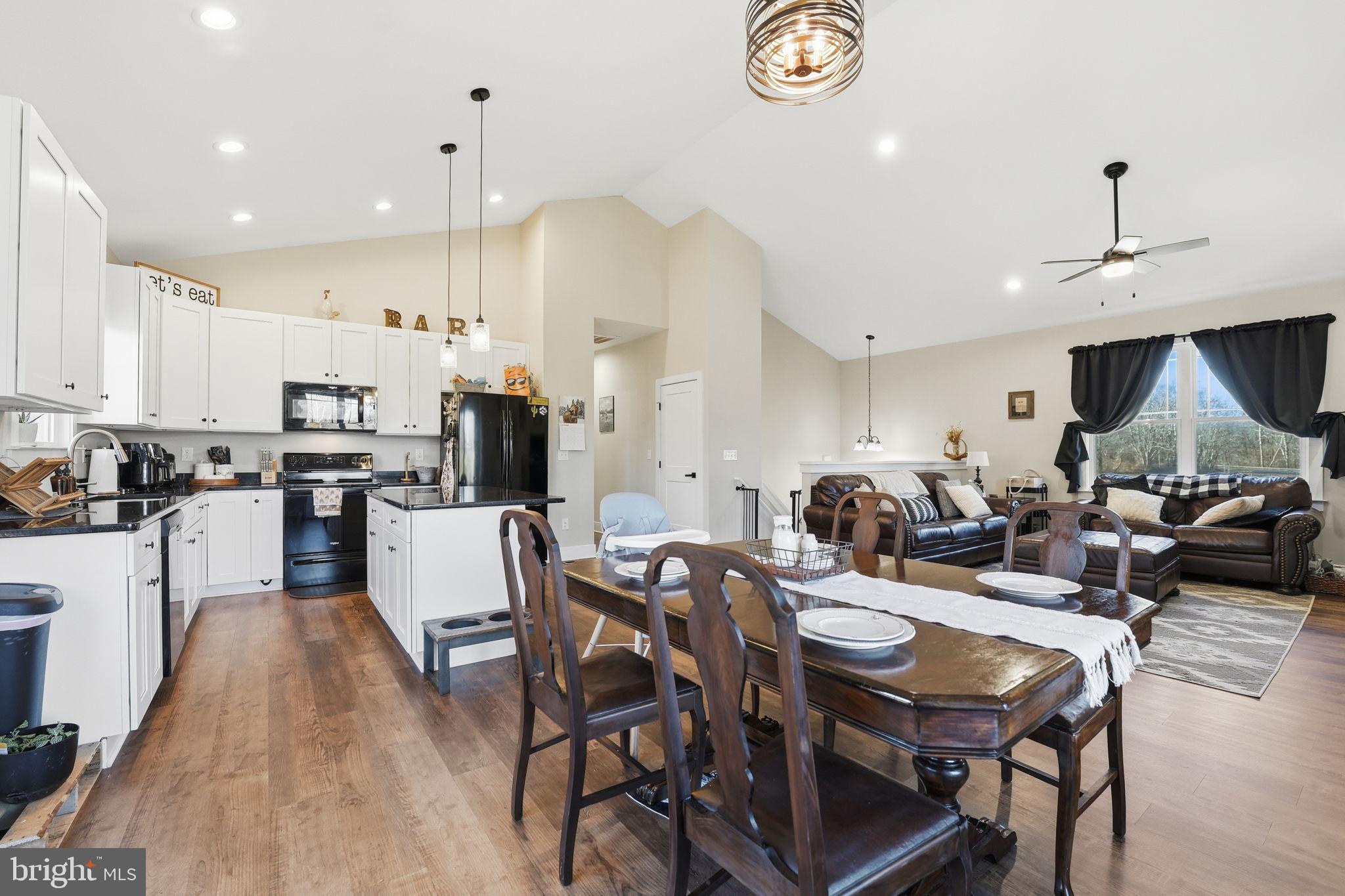 11183 Drogheda Mountain Road Culpeper, VA 22701 - Photo 5 of 60 a large kitchen with a table and chairs in it