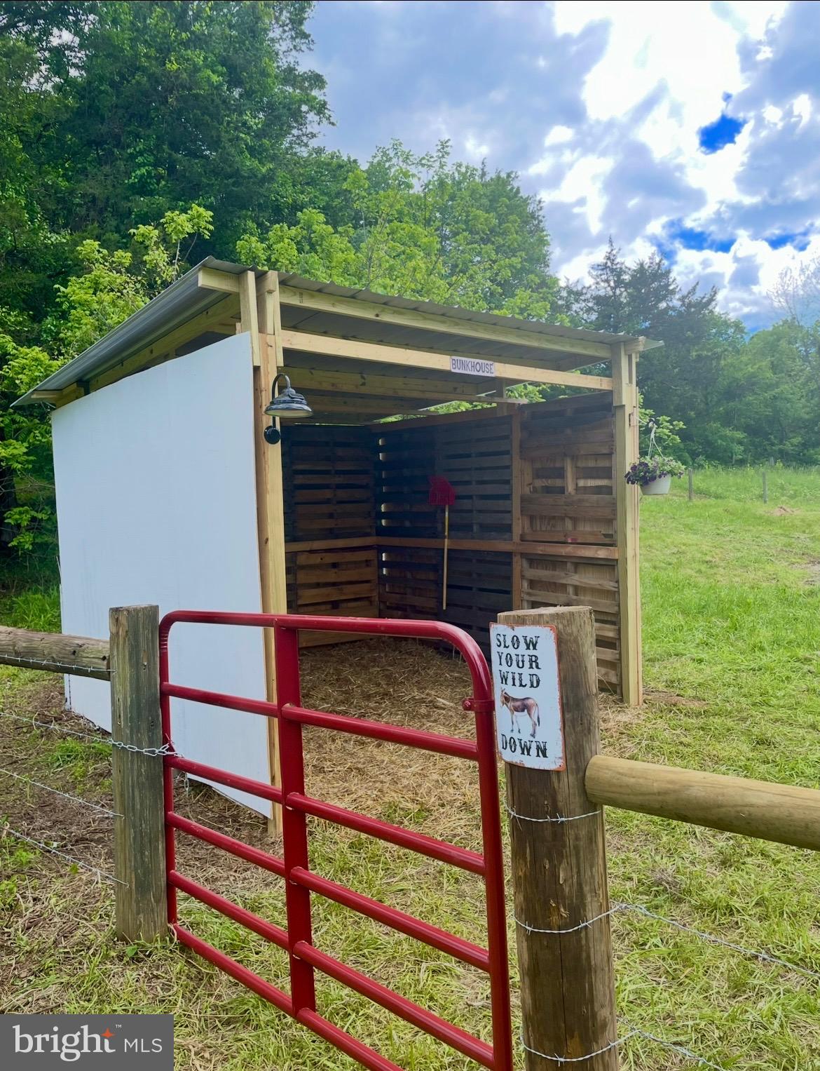 11183 Drogheda Mountain Road Culpeper, VA 22701 - Photo 53 of 60 a front view of a house with a yard