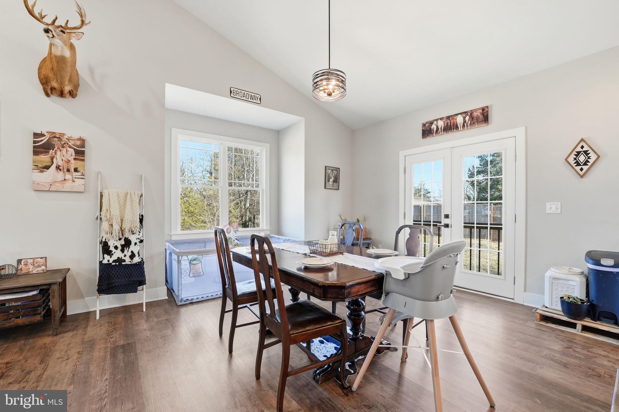 11183 Drogheda Mountain Road Culpeper, VA 22701 - Photo 6 of 60 a view of a dining room with furniture window and wooden floor