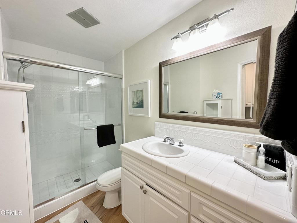 2901 Peninsula Road, Unit 347 Oxnard, CA 93035 - Photo 13 of 13 a bathroom with a sink a toilet and shower