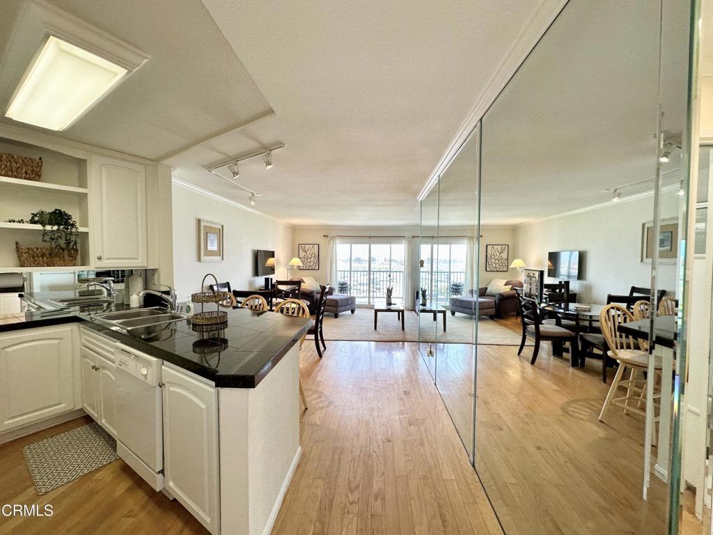 2901 Peninsula Road, Unit 347 Oxnard, CA 93035 - Photo 2 of 13 a kitchen with lots of counter and chairs