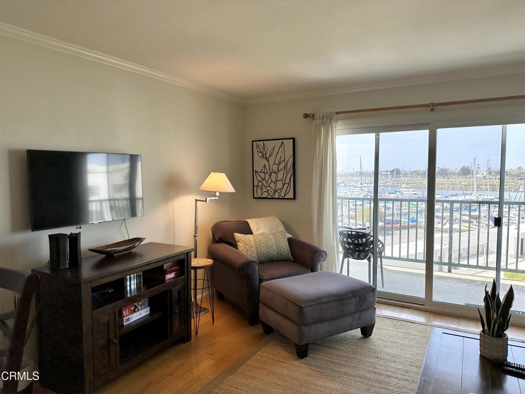2901 Peninsula Road, Unit 347 Oxnard, CA 93035 - Photo 6 of 13 a living room with furniture and a flat screen tv
