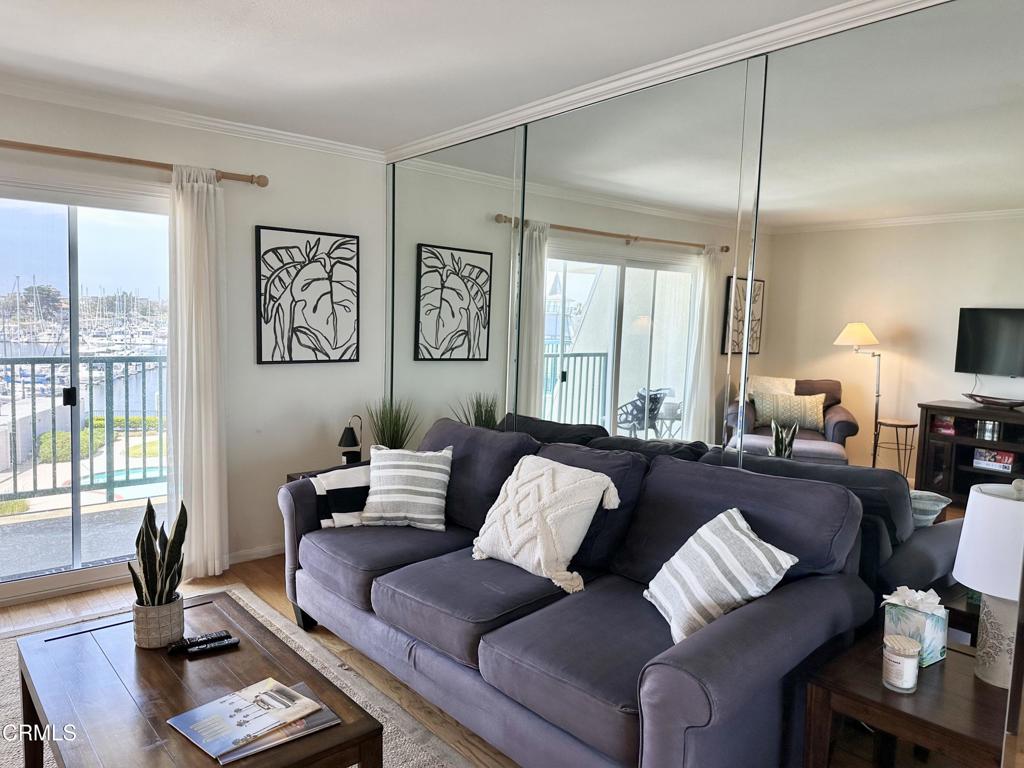 2901 Peninsula Road, Unit 347 Oxnard, CA 93035 - Photo 7 of 13 a living room with furniture and a large window