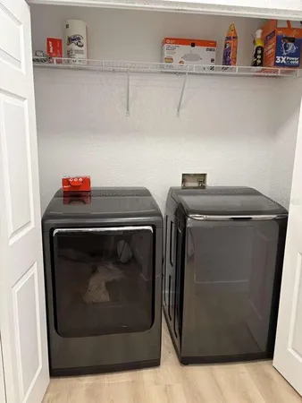 a utility room with dryer and washer