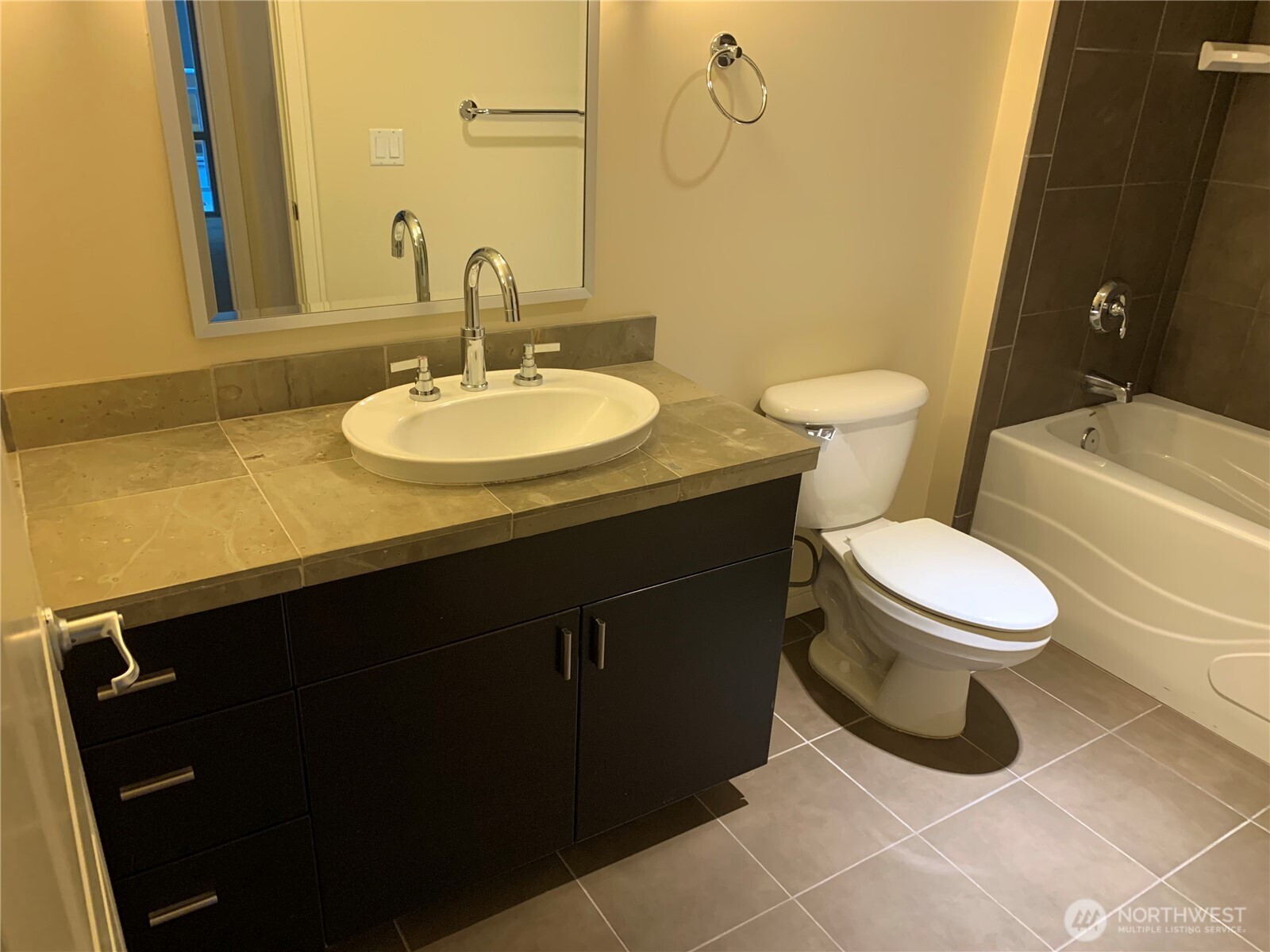 819 Virginia Street, Unit 2808 Seattle, WA 98101 - Photo 19 of 34 a bathroom with a sink toilet and a mirror